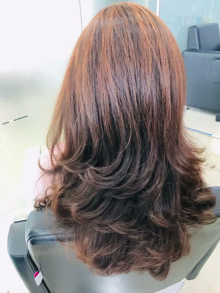 Layered brunette hair after salon styling
